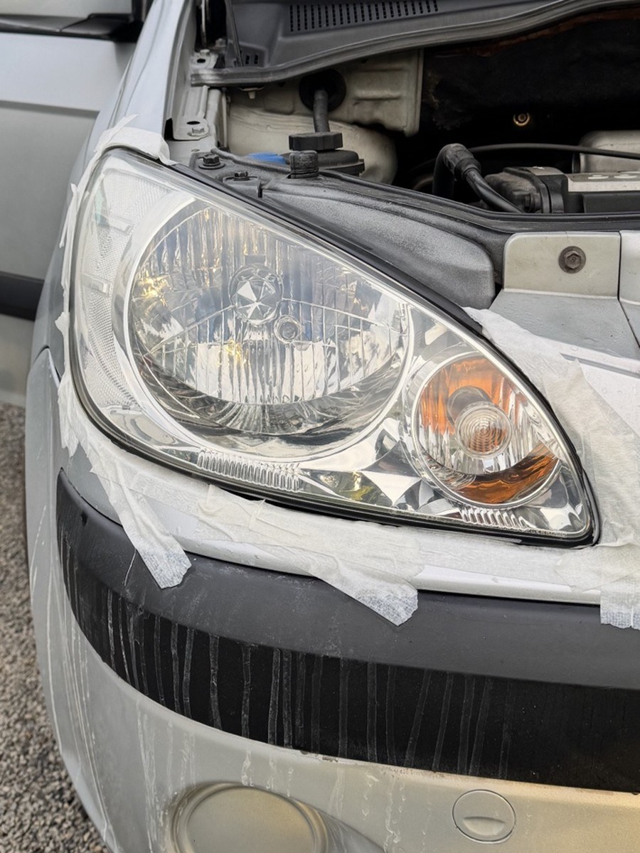 Hatchback headlight after restoration, clear and glossy