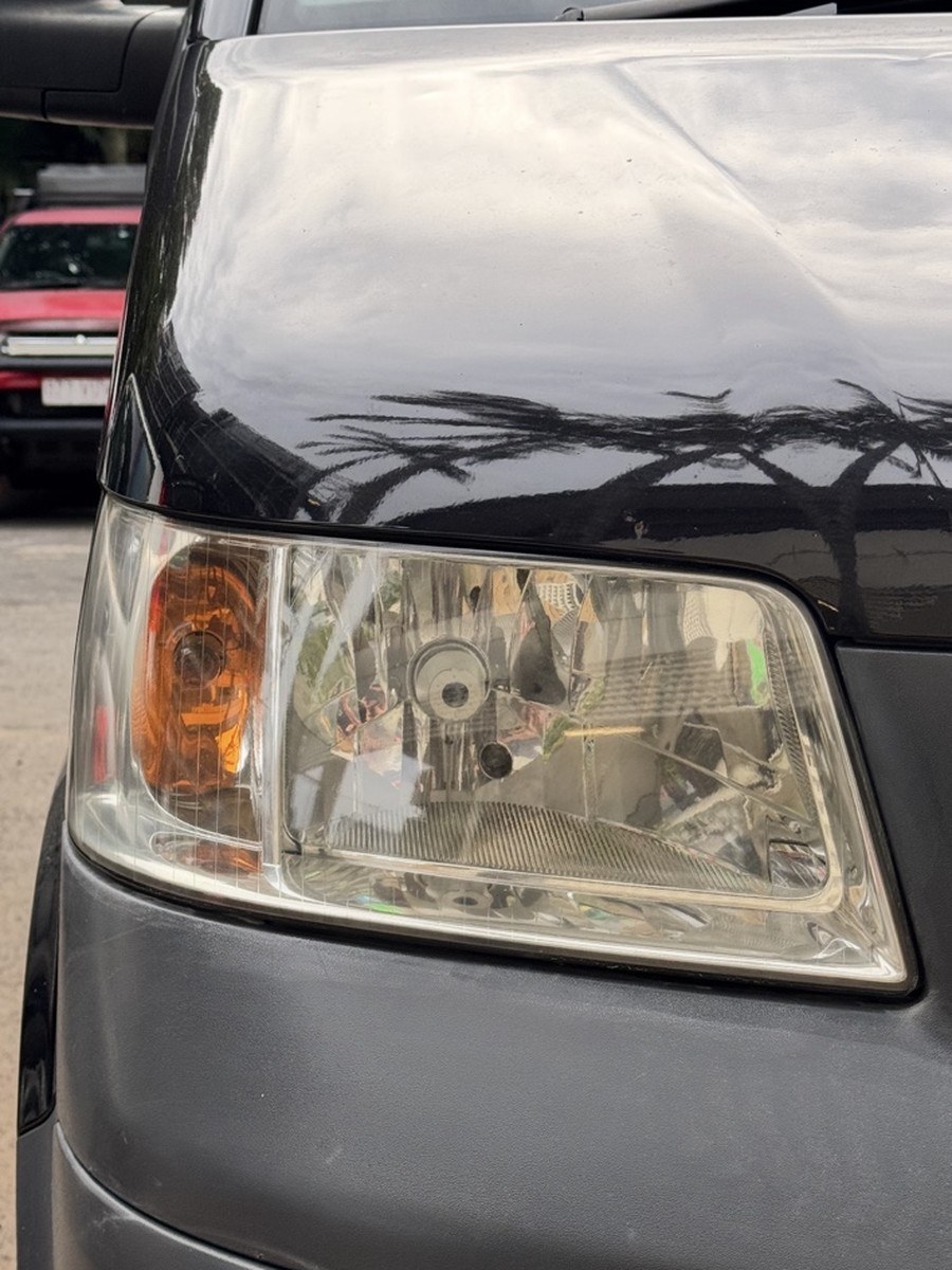 Van headlight after restoration, clear and glossy