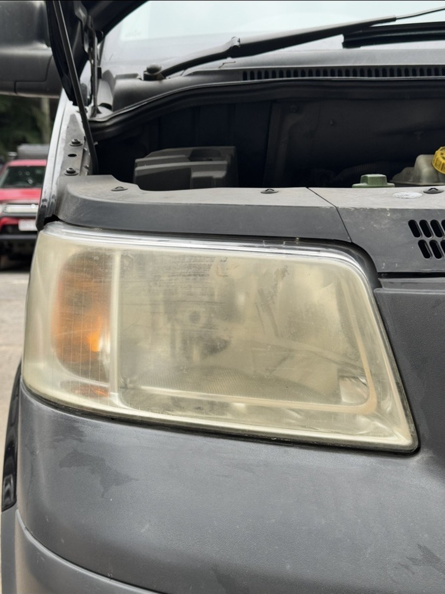 Van headlight before restoration, cloudy and yellowed