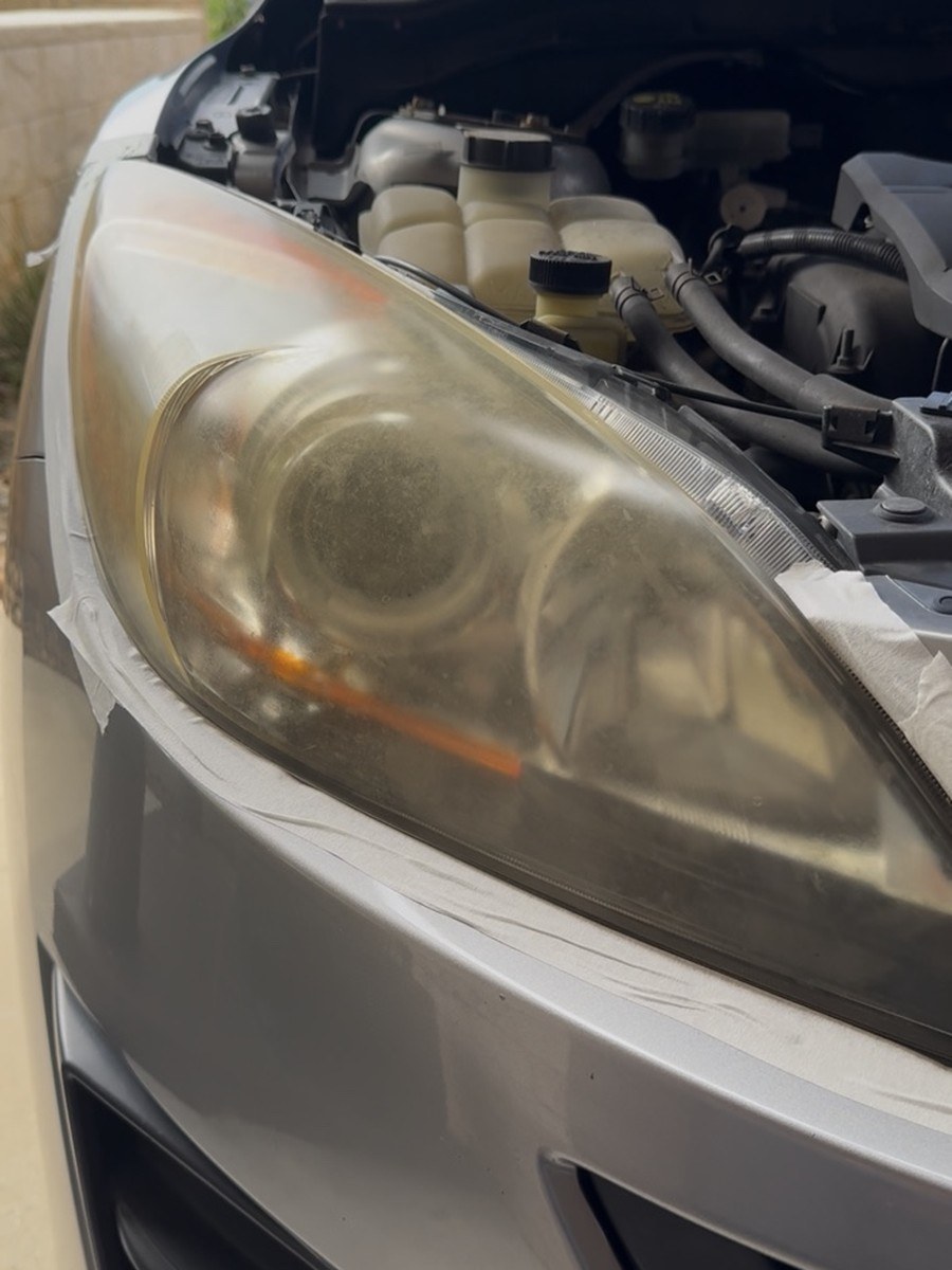 Wagon headlight before restoration, cloudy and yellowed